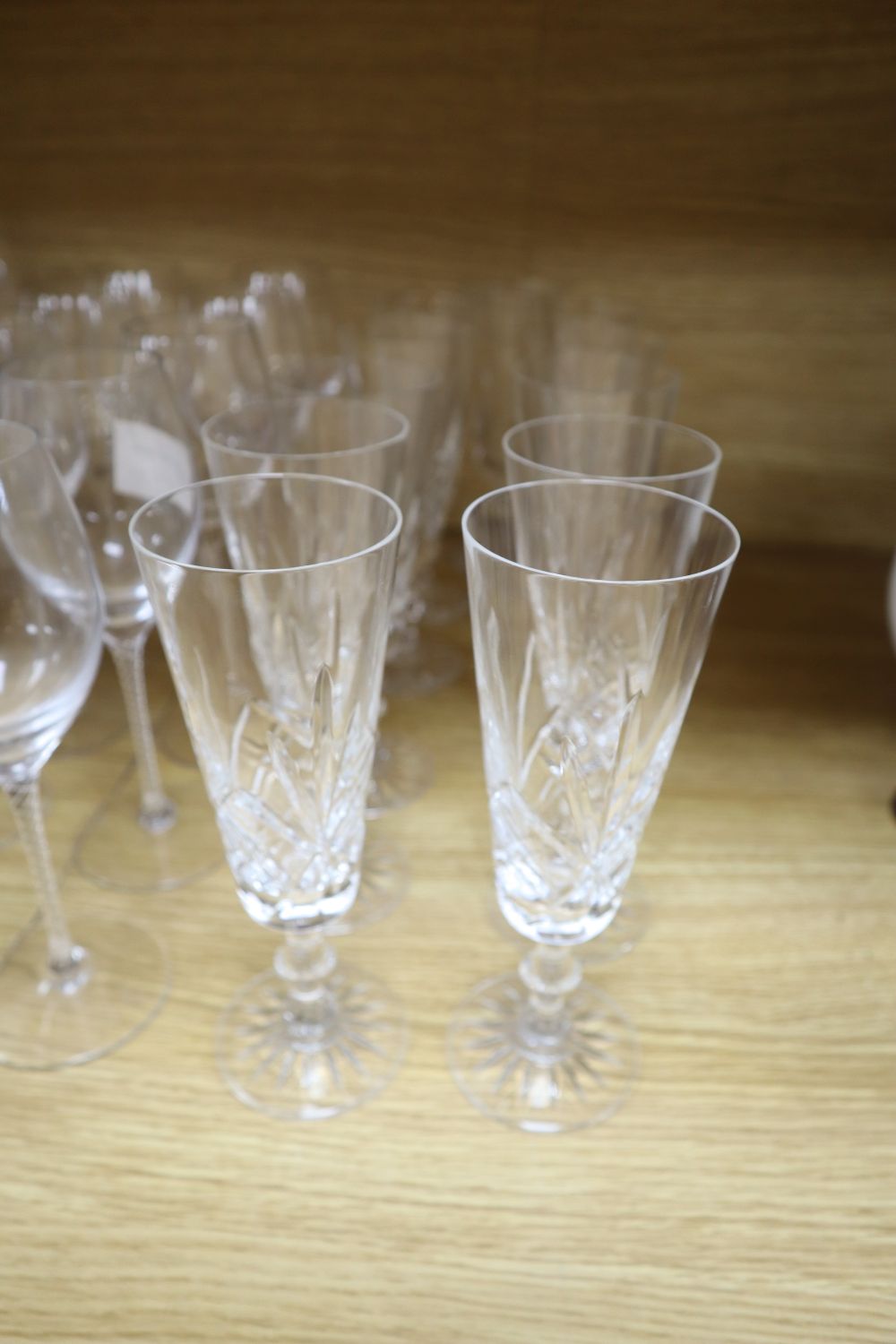 Twenty air twist stemmed wine glasses and eleven cut glass champagne flutes (31)